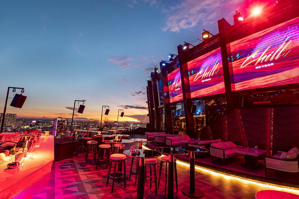 Chill Skybar turns enchanting after dark, as its vibrant neon lights create an atmosphere that is both luxurious and free-spirited